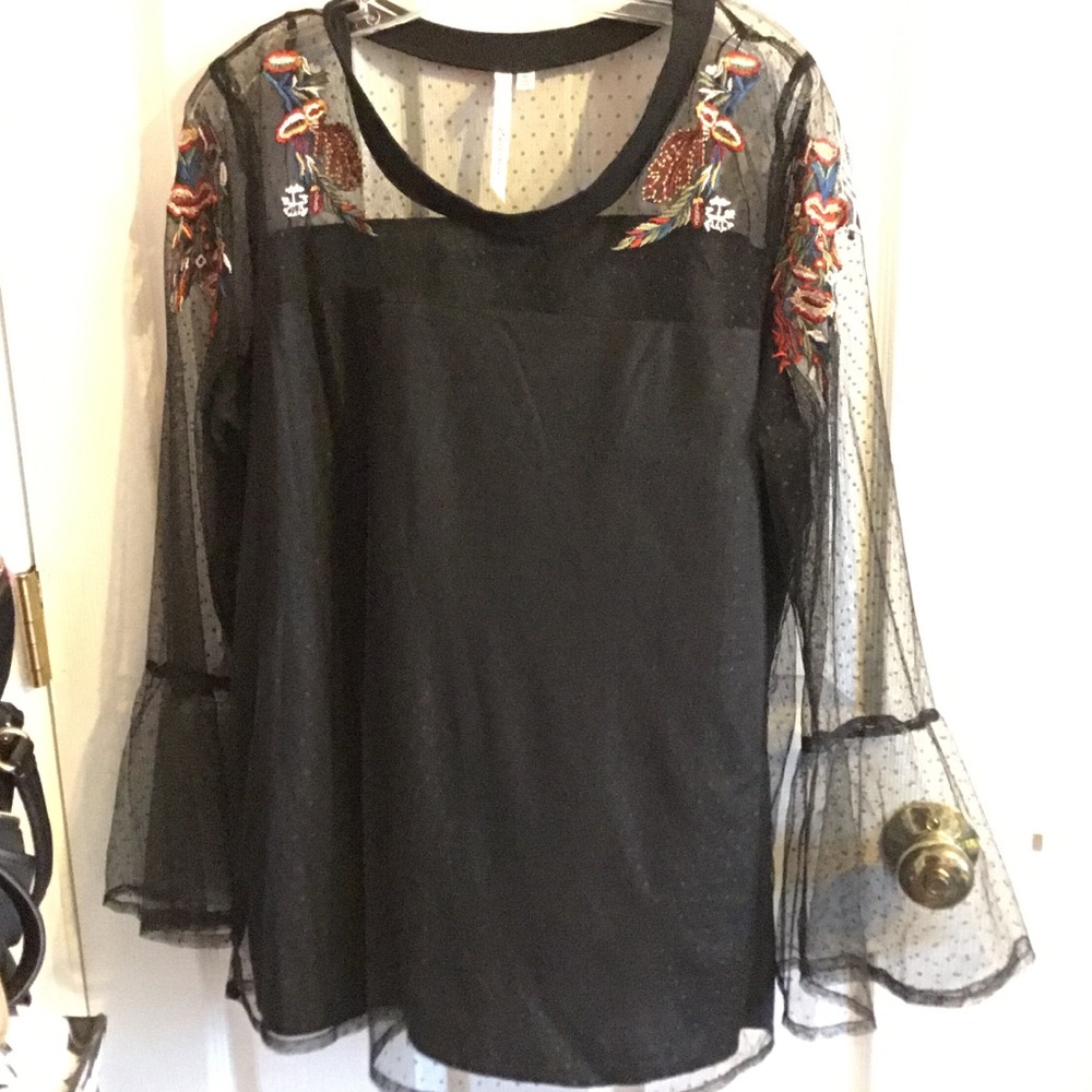 Black lace embroidered bell sleeve top.